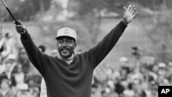 FILE - Charlie Sifford throws up his arms after he dropped a short par putt on the 18th green to tie Harold Henning of South Africa at the end of 72 holes in the $100,000 Los Angeles Open golf tournament, Sunday, Jan. 13, 1969.
