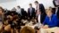 German Chancellor Angela Merkel, chairwoman of the Christian Democratic Union, CDU, sits next to CSU's Alexander Dobrindt, second from right, the deputy of the joint CDU/CSU faction in the German parliament prior to a faction meeting, July 2, 2018.