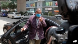 Hong Kong media tycoon and newspaper founder Jimmy Lai arrives at a police station to report in as a part of his bail condition in Hong Kong, Sept. 1, 2020.