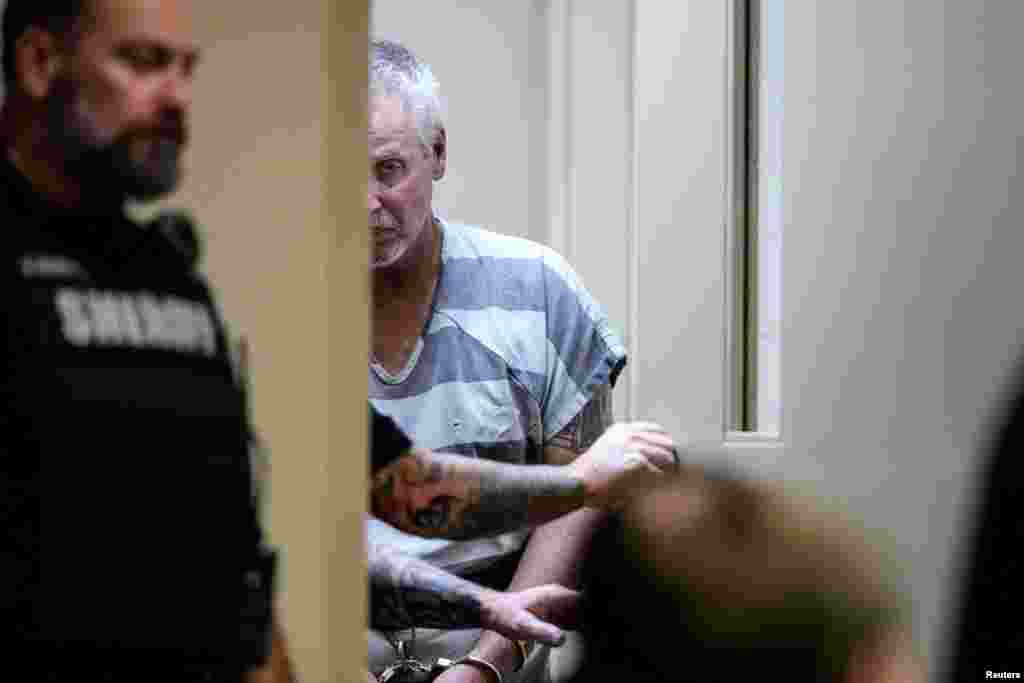 Colin Gray, 54, the father of Apalachee High School shooting suspect Colt Gray, who is charged as an adult with four counts of murder, walks in the Barrow County courthouse on the day of his and his son's first appearance, in Winder, Georgia.