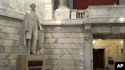 FILE - This July 20, 2017 file photo shows a statue of Jefferson Davis in the Kentucky Capitol in Frankfort, Ky. 