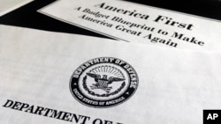 A portion of President Donald Trump's first proposed budget, focusing on the Department of Defense, and released by the Office of Management and Budget, is photographed in Washington, March 15, 2017. 