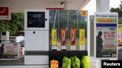 FILE - A Shell gas station that has run out of fuel is seen in Northwich, Britain, May 27, 2021. 