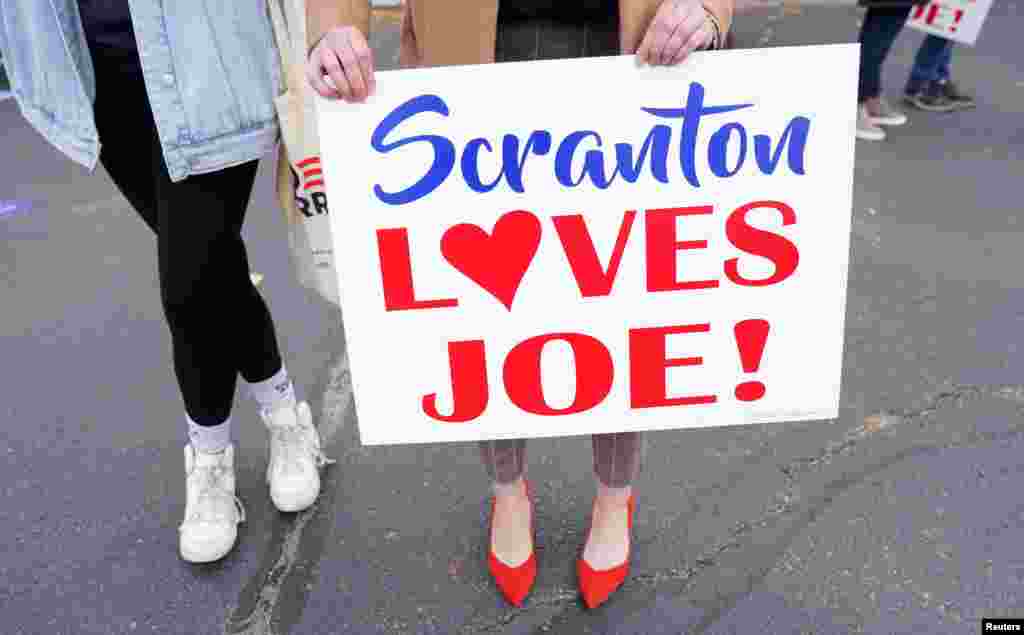 A supporter holds a sign during an event by U.S. Democratic presidential nominee Joe Biden on Election Day in Scranton, Pennsylvania, Nov. 3, 2020.