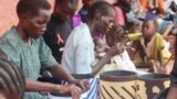 Women in South Sudan are learning to make handcrafts that they can sell at local markets to earn an income. (D. Silva/VOA)