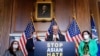 Senate Majority Leader Chuck Schumer (D-NY) is joined by fellow Democrats as he speaks at a news conference after the Senate passed the COVID-19 Hate Crimes Act on Capitol Hill in Washington, April 22, 2021. 