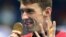 United States' Michael Phelps celebrates winning the gold medal in the men's 200-meter individual medley during the swimming competitions at the 2016 Summer Olympics, Aug. 11, 2016, in Rio de Janeiro, Brazil.