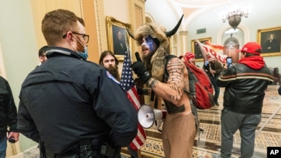 Arizona Man Known as 'QAnon Shaman' Pleads Guilty to Felony in