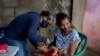 A child is vaccinated in Barcelona, Anzoategui State, Venezuela, March 16, 2021. In Venezuela there are people who had malaria up to 20 times.