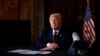 U.S. President Donald Trump takes questions from the media after speaking via teleconference with troops from Mar-a-Lago estate in Palm Beach, Florida, Nov. 22, 2018. 