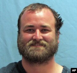 This photo provided by the Pulaski County Sheriff's Office in Little Rock, Ark., shows Michael Tate Reed, of Van Buren, Ark., who was booked into the jail, June 28, 2017, on preliminary charges of defacing objects of public interest, criminal trespass and first-degree criminal mischief.