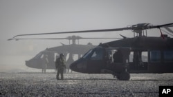 Blackhawk helicopters are parked at a U.S. military base at undisclosed location in Eastern Syria, Nov. 11, 2019.