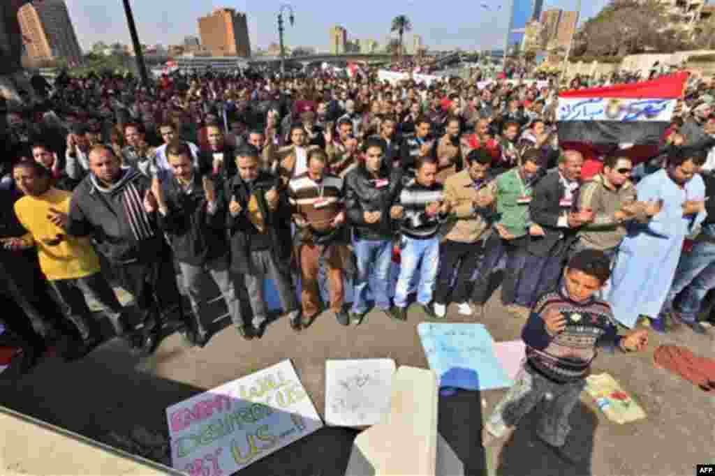 Egyptian pro-Mubarak supporters perform prayers during a march in Cairo, Egypt, Tuesday, Feb. 1, 2011. Egyptian authorities battled to save President Hosni Mubarak's regime with a series of concessions and promises to protesters, but realities on the stre