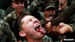 A soldier is fed snake blood during the Cobra Gold multilateral military exercise in Chanthaburi, Thailand, February 14, 2019.