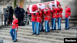 The coffin leaves the church after the funeral of Prince Henrik which took place at Christiansborg Palace Chapel in Copenhagen, Denmark, Feb. 20, 2018.