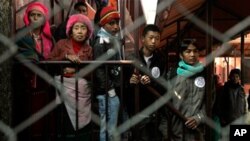 Bhutanese refugees wait to leave for resettlement abroad at a facility of International Organization for Migration in Nepal. 