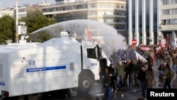 Turkish riot police use water cannons against protesters during a demonstration against the ruling Ak Party and Prime Minister Tayyip Erdogan, in Istanbul, Dec. 22, 2013. 