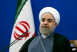 Iran's President Hassan Rouhani, speaking at a Tehran news conference on the second anniversary of his election, vowed that his nation wouldn't allow state secrets to be jeopardized under the cover of international inspections. June 13, 2015.