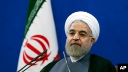 伊朗总统鲁哈尼在新闻发布会上（2015年6月13日）