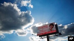 A billboard advertising treatment for opioid addition stands in Dickson, Tennessee, June 7, 2017. More than 2 million people in the U.S. are hooked on opioids. Overdoses from these drugs are killing an average of 120 people every day. 