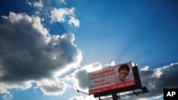 FILE - A billboard advertising treatment for opioid addiction stands in Dickson, Tenn., June 7, 2017. 