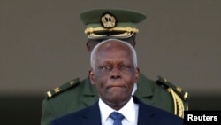 FILE - Angolan President Jose Eduardo dos Santos leaves the Planalto Palace after a meeting with Brazil's President Dilma Rousseff in Brasilia, June 16, 2014. 