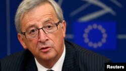 FILE - Incoming president of the European Commission Jean-Claude Juncker answers journalists questions during a press briefing in Strasbourg, July 15, 2014. 