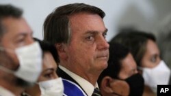 Perezida wa Brezile Jair Bolsonaro i Brasilia, muri Brezile, mu gihe c'ikiza ca COVID-19.