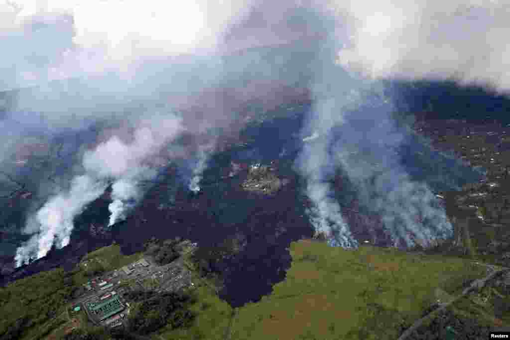 Lava approaches Puna Geothermal Venture, bottom left, in the Leilani Estates near Pahoa, Hawaii, May 28, 2018.