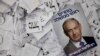 FILE - In this Wednesday, March 18, 2015 file photo, an election campaign poster with the image of Israeli Prime Minister Benjamin Netanyahu lies among ballot papers at his party's election headquarters, in Tel Aviv. 