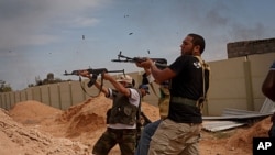 Libyan provisional government fighters attacking pro-Gadhafi forces in Sirte, Oct. 7, 2011.