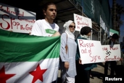 Syrian-Americans protest Russian intervention in Syria outside a Russian consular office in Santa Monica, California, United States, October 6, 2015.