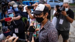Playwright Yunior Garcia speaks to the press as he leaves a provincial prosecutor's office in Havana, Cuba, Oct. 21, 2021. Garcia is one of several organizers of a protest scheduled for November 15, that was previously denied government authorization.