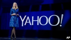 FILE - Yahoo President and CEO Marissa Mayer speaks during the International Consumer Electronics Show in Las Vegas, Jan. 7, 2014..