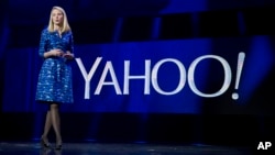 FILE - Yahoo President and CEO Marissa Mayer speaks during the International Consumer Electronics Show in Las Vegas, Jan. 7, 2014.