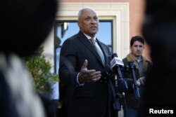 U.S. Senate candidate Mike Espy takes an interview with media during a news conference in Jackson, Mississippi, Nov. 26, 2018.