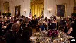 President Barack Obama speaks as he hosts a dinner for members of the U.S. military who served in Iraq in the East Room of the White House in Washington, Feb., 29, 2012.