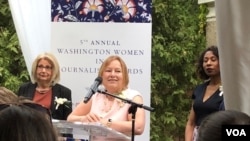 VOA Director Amanda Bennett (center) at awards ceremony.