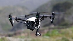 FILE - The Inspire 1, a drone manufactured by DJI, is flown in Davenport, Calif., March 10, 2015.