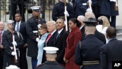 Former President Barack Obama and his wife Michelle stand with President Donald Trump and first lady Melania Trump during a departure ceremony on the East Front of the U.S. Capitol in Washington, Jan. 20, 2017, after Trump was inaugurated.