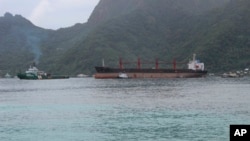The North Korean cargo ship, Wise Honest, middle, was towed into the Port of Pago Pago, May 11, 2019, in Pago Pago, American Samoa.