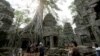 Tourists visit the Ta Prohm temple complex in Siem Reap province, Cambodia, March 16, 2019.