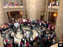 Supporters of abortion rights rally against recently passed restrictions on abortions in the Statehouse rotunda, May 21, 2019, at the Nebraska Capitol in Lincoln, Nebraska.