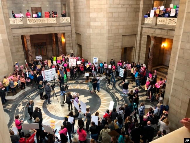 Supporters of abortion rights rally against recently passed restrictions on abortions in the Statehouse rotunda, May 21, 2019, at the Nebraska Capitol in Lincoln, Nebraska.