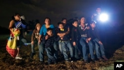 FILE - A group of young migrants from Honduras and El Salvador who crossed the U.S.-Mexico border.