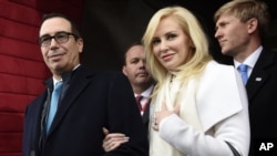 FILE - then Treasury Secretary-designate Stephen Mnuchin and his then-fiancee, Louise Linton, arrive on Capitol Hill in Washington, for the presidential inauguration of Donald Trump. 