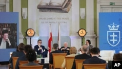 People attend a conference inaugurating a new conservative university, Collegium Intermarium, which aims to educate a new generation of lawyers in central Europe, in Warsaw, Poland, May 28, 2021.