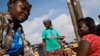 A vendor sorts tomatoes at the Agbogboloshie food market in Accra, Ghana, FILE June 6, 2008.