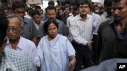 Indian Railway Minister and leader of the Trinamool Congress party Mamata Banerjee meets with people outside her home, a day before results for the state elections are announced, in Kolkata, India, May 12, 2011