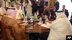 Seated from left clockwise at table, Saudi Foreign Minister Adel al-Jubeir, United Arab Emirates Foreign Minister Abdullah bin Zayed al-Nahyan, Egyptian Foreign Minister Sameh Shoukry, and Bahraini Foreign Minister Khalid bin Ahmed al-Khalifa meet in Cair